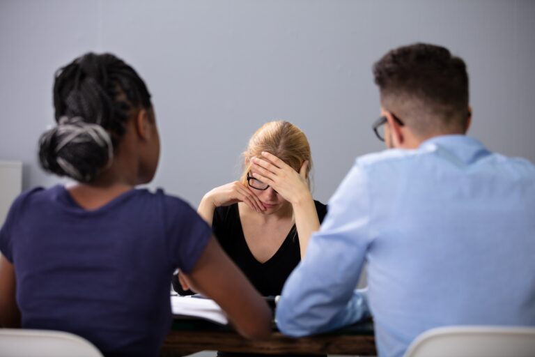 Women facing unfair dismissal during meeting with managers